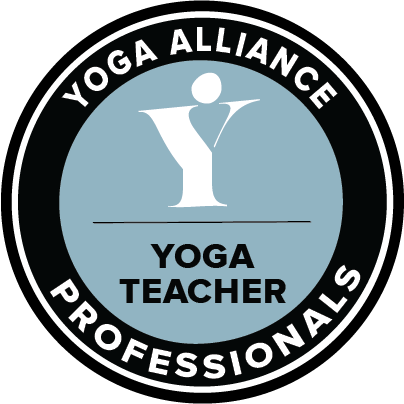 Yoga Alliance Professionals badge featuring a stylised yogi icon inside a circular black and blue emblem.