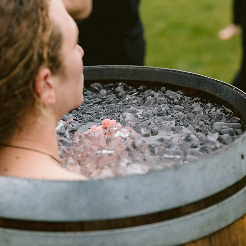 Someone using the wim hof breathing method in an ice bath at soul sweats